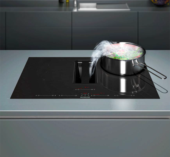Isla de cocina con placa de inducción con extractor integrado
